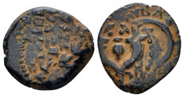 Judaea, John Hyrkanos I, 135-104 Jerusalem Prutah circa 135-104, Æ 16.00 mm., 2.05 g.
Legend within wreath. Rev. Splayed double cornucopia with pomeg...