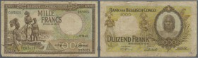 Belgian Congo: Belgian Congo: 1000 Francs 1947, P.19b in well worn condition with many folds and creases, stained paper, tiny tears along the borders,...