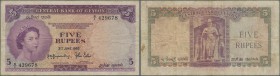 Ceylon: 5 Rupees 1952 with prefix G/1, P.52, lightly stained paper with several folds. Condition: F