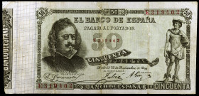 1899. 50 pesetas. (Ed. B91a) (Ed. 307a). 25 de noviembre, Quevedo. Serie E. Reparaciones. Raro. BC+.