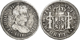 1811. Fernando VII. Lima. JP. 1/2 real. (AC. 353). Primer año de busto laureado grande. Ex Áureo 29/09/2004, nº 1010. Escasa. 1,57 g. BC.