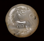 A greek lentoid chalcedony seal intaglio. Lioness.