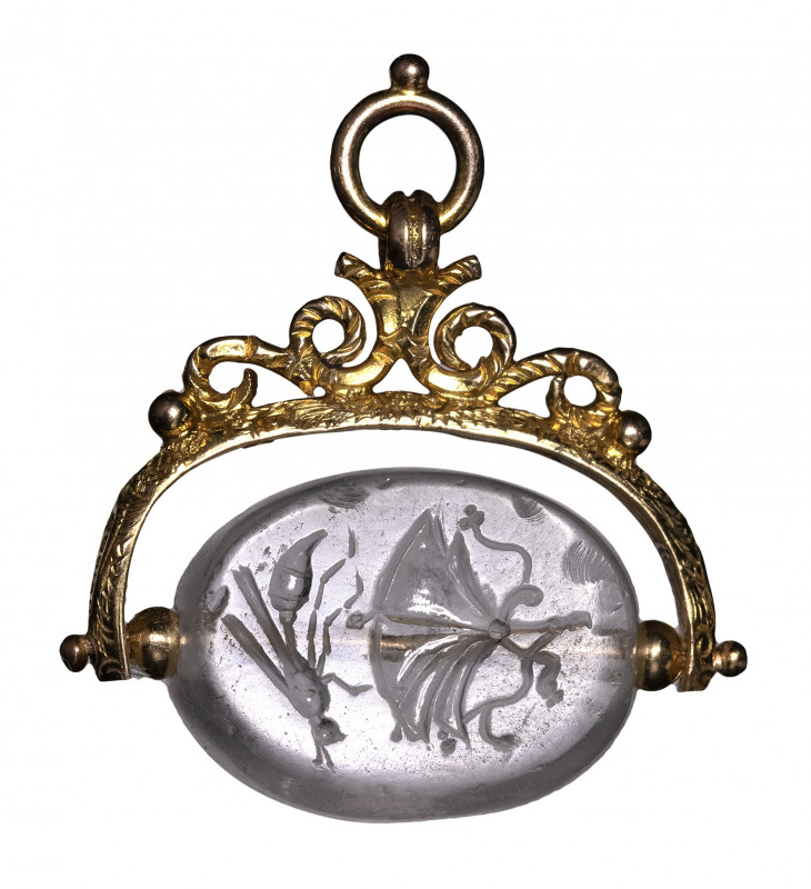 A rare greek classical rock crystal scaraboid engraved seal set in a gold seal. ...