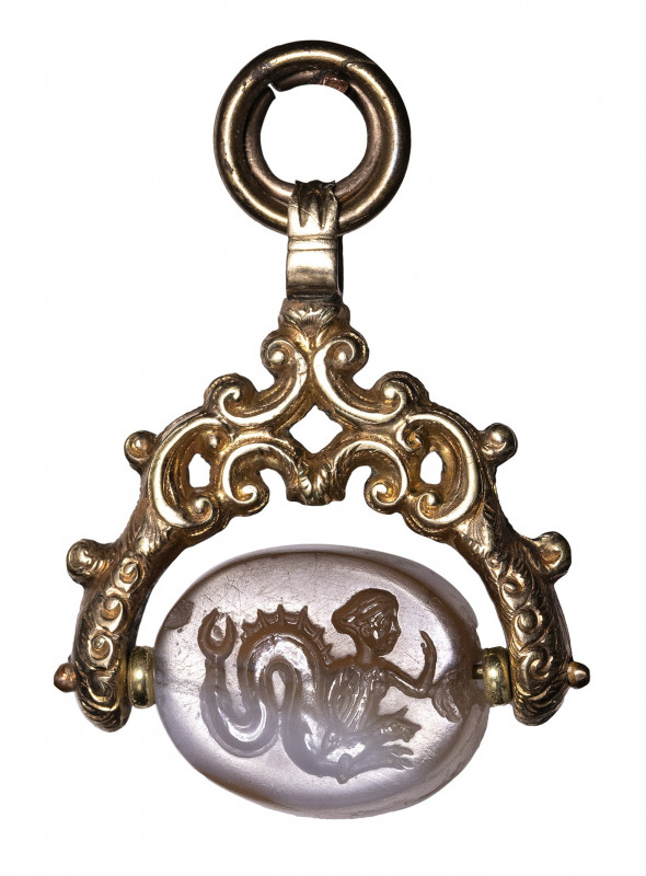 A greek classical banded agate scaraboid engraved seal set in a gold seal. Scyll...