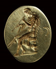 A fine electrum greek ring.  Paris seated with an harrow.