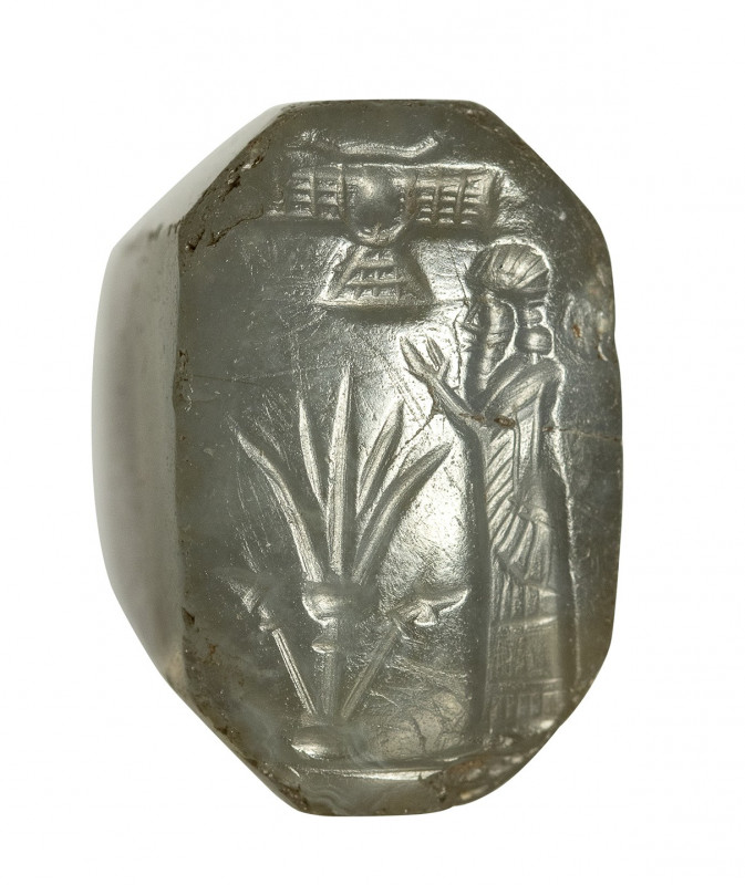 An assyro-babylonian bluish-grey chalcedony stamp seal. Ritual scene, 

8th - ...