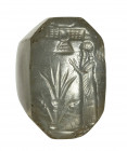 An assyro-babylonian bluish-grey chalcedony stamp seal. Ritual scene,