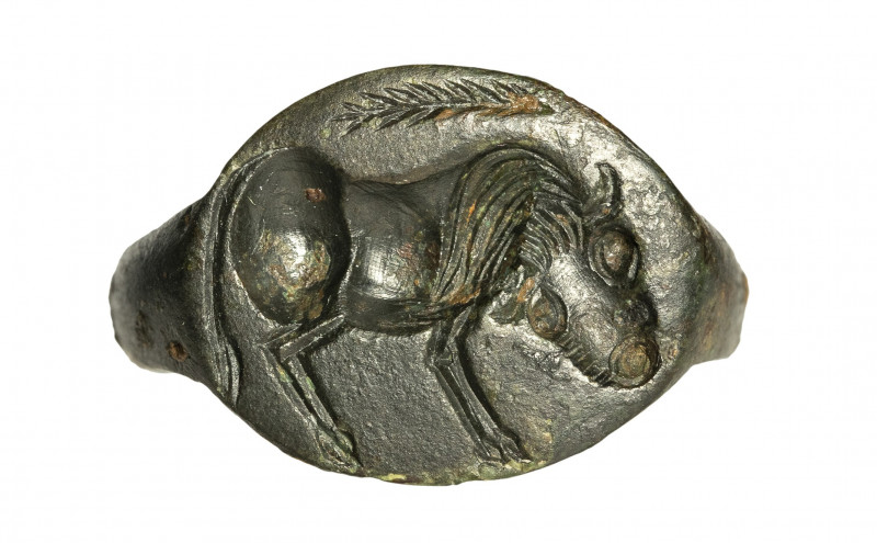 An eastern greek bronze engraved ring. Bull. 

5th century B.C.

15 x 20 mm;...