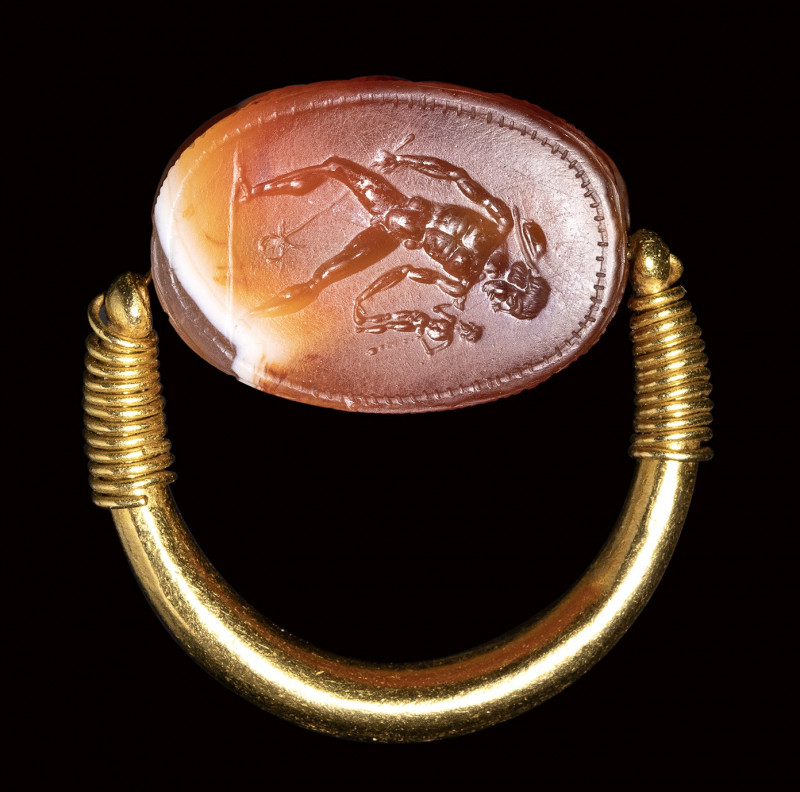 A fine etruscan banded agate scarab intaglio set in a swivel gold ring. Hermes P...