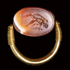 A fine etruscan banded agate scarab intaglio set in a swivel gold ring. Hermes Psychopomp.