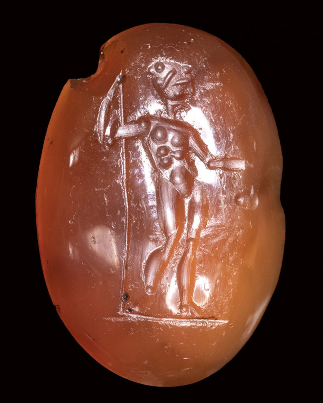 An italic carnelian intaglio. Standing male figure. 

1st century B.C.

12x1...
