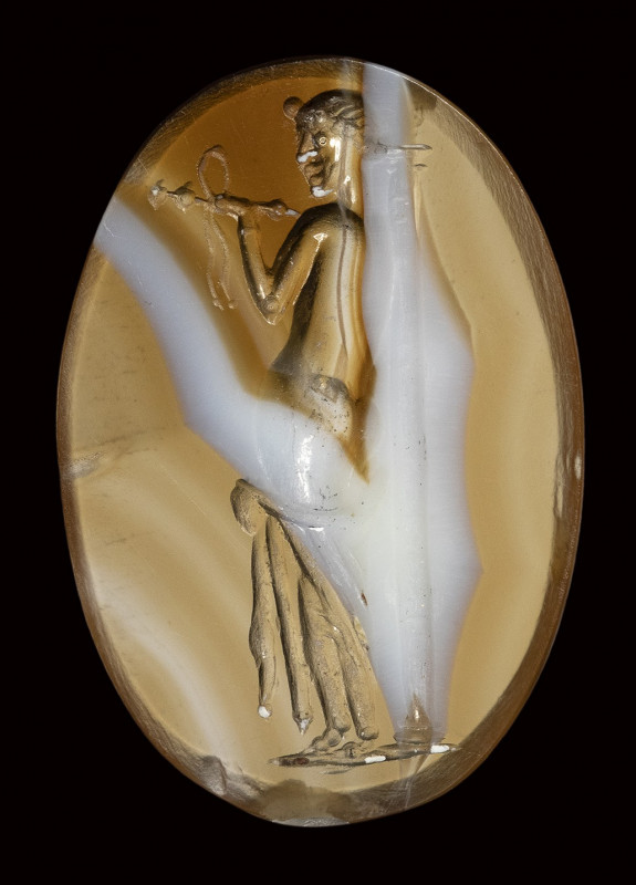 A large roman italic banded agate intaglio. Venus with a column.

2nd century ...