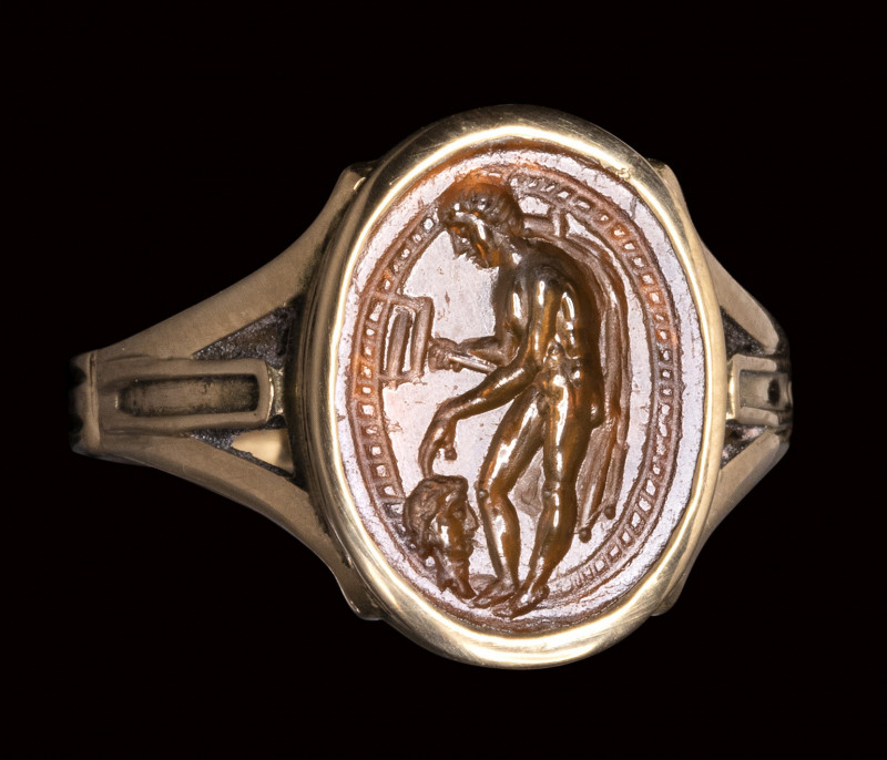 An italic sard intaglio set in a gold ring. Hermes psychopomp.

2nd century B....