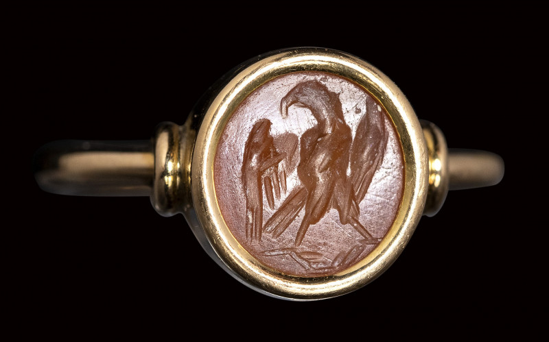 A roman carnelian intaglio set in a gold ring. Eagle. 

2nd - 3rd century A.D....