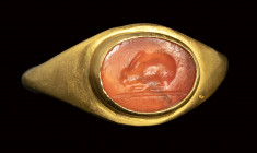 A roman carnelian intaglio set in an ancient gold ring. Rabbit.