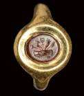 A roman carnelian intaglio set in a gold ring. Dextrarum Junctio.