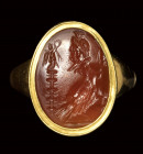 A roman carnelian intaglio set in a gold ring. Allegory of Zeus Sarapis.