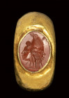 A roman red jasper intaglio set in an ancient gold ring. Gryllos.