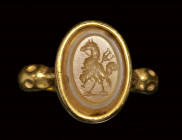 A roman three-layered agate intaglio set in a gold ring. Gryllos.
