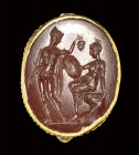 A roman carnelian intaglio set in a gold ring. Perseus and Andromeda.