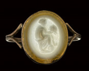 A roman late republican two-layered agate intaglio mounted on an early 19th century gold ring. Muse with mask.