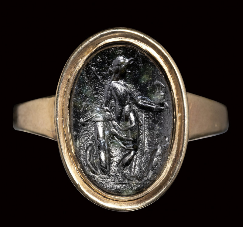 A roman dark green chalcedony intaglio set in a gold ring. Venus Victrix.

2nd...
