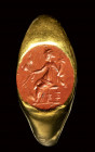 A roman gold ring set with a red jasper intaglio. Fortuna-Tyche.