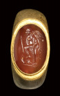 A roman gold ring with carnelian intaglio. Eros with weapons.