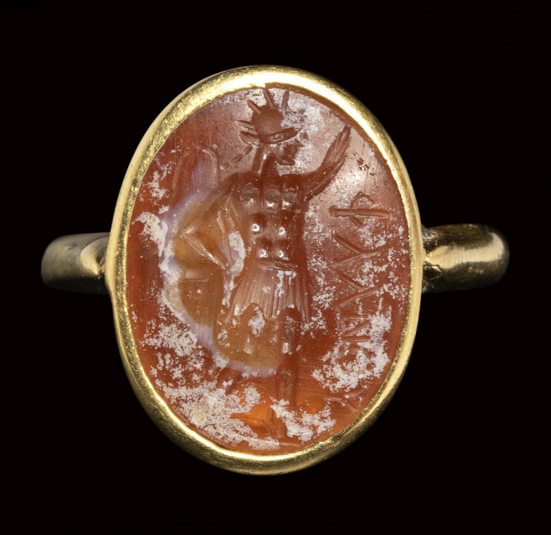 A roman burnt carnelian intaglio set in a gold ring. Sol Invictus. 

2nd - 3rd...