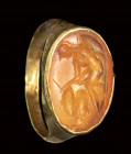 A roman carnelian intaglio set in an ancient gold ring. Warrior.