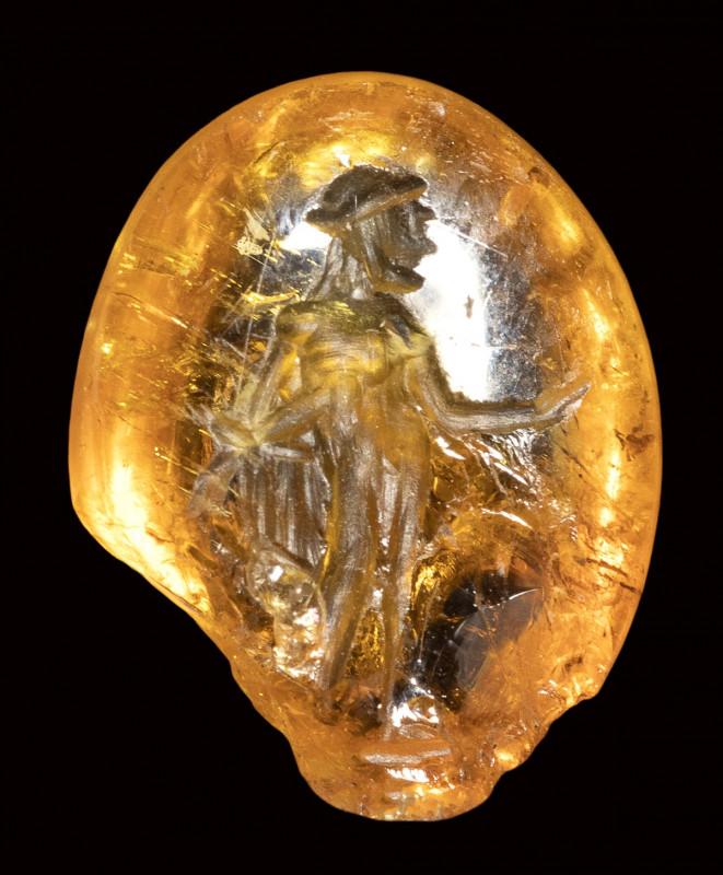 A rare roman citrine intaglio. Apollo.

2nd century A.D. 

9,5 x 12 x 4 mm....