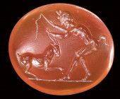 A roman carnelian intaglio. Faun with goat.