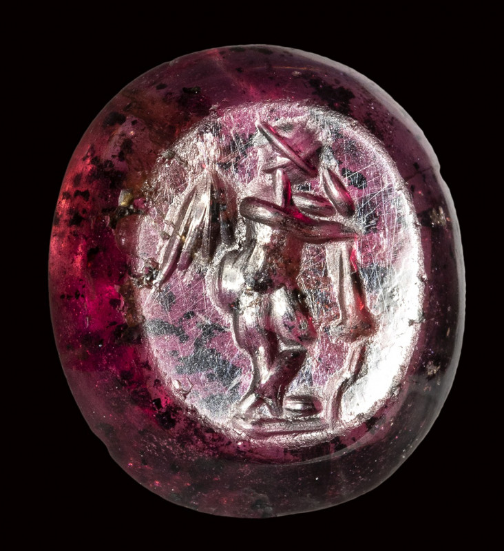 A roman garnet intaglio. Eros with a torch.

3rd century A.D.

11 x 12 x 3 m...