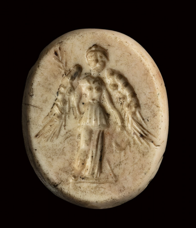 A roman burnt carnelian intaglio. Victory. 

1st century B.C. 

13 x 15 x 2,...