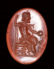 A roman carnelian intaglio. Seated Zeus.