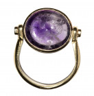 A roman amethyst intaglio set in a modern gold ring with diamonds. Bust of Nereid.