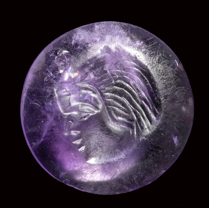 A fine roman republican amethyst intaglio. Mask.

1st century B.C.

Diam. 16...