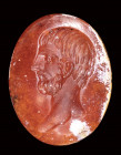 A roman burnt carnelian intaglio. Male portrait.