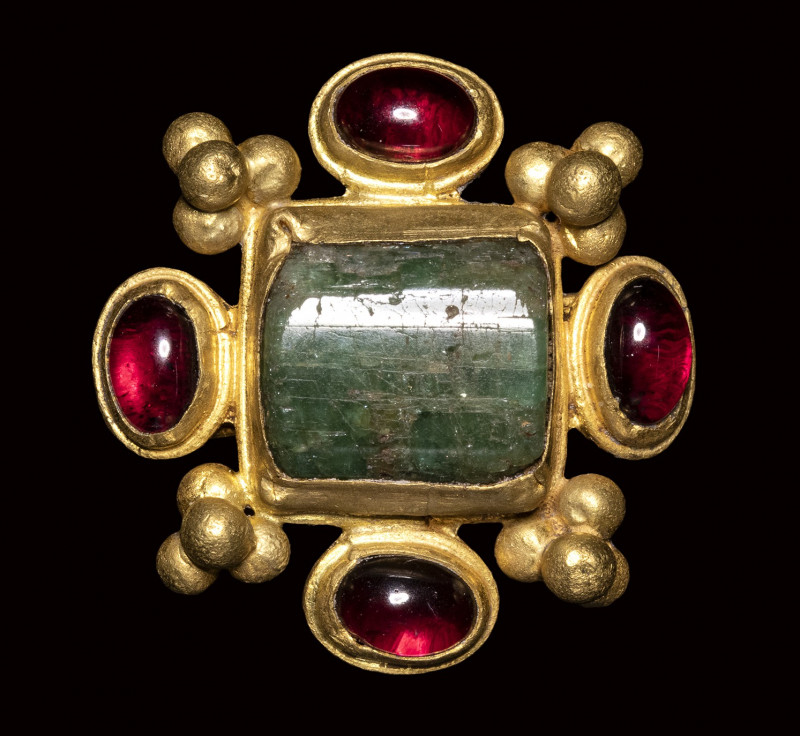 A late roman gold ring set with emerald and garnets. 

4th - 5th century A.D....