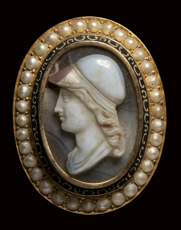 An agate cameo set in a gold brooch with enamel and pearls. Portrait of Athena. ...