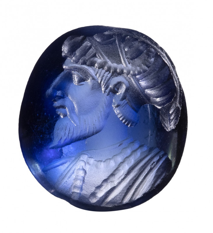 A safavid blue sapphire intaglio. Bust of a ruler. 

16th - 17th century 

9...