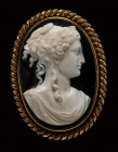A large neoclassical agate cameo set in a gold brooch. Female bust.