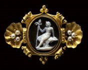 A french onyx cameo set in a gold brooch with pearls. Dyonisus with tyrsus.
