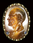 A fine agate intaglio set in a gold brooch with precious stones. Male portrait.