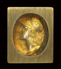 A fine chalcedony intaglio set in a contemporary gold brooch with diamonds. Helmeted bust of Athena.