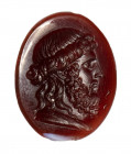 A glass paste impression.  Aesclepius.