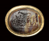 A polychrome glass paste impression set in a gold ring.  The "Michelangelo seal".