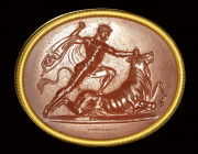 A fine neoclassical Poniatowski  carnelian intaglio signed Dioskourides, set in a gold frame. Milo killing the bull.