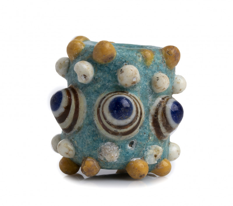 PHOENICIAN GLASS PASTE BEAD
4th - 3rd centuries BC
height cm 3,2

Rod-formed gla...