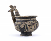 VILLANOVAN IMPASTO CUP
9th - 8th centuries BC
height cm 11

A rare example of Villanovan cup characterized by a bridged and mullioned handle with zoom...